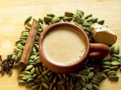 Tea served in a clay cup with background